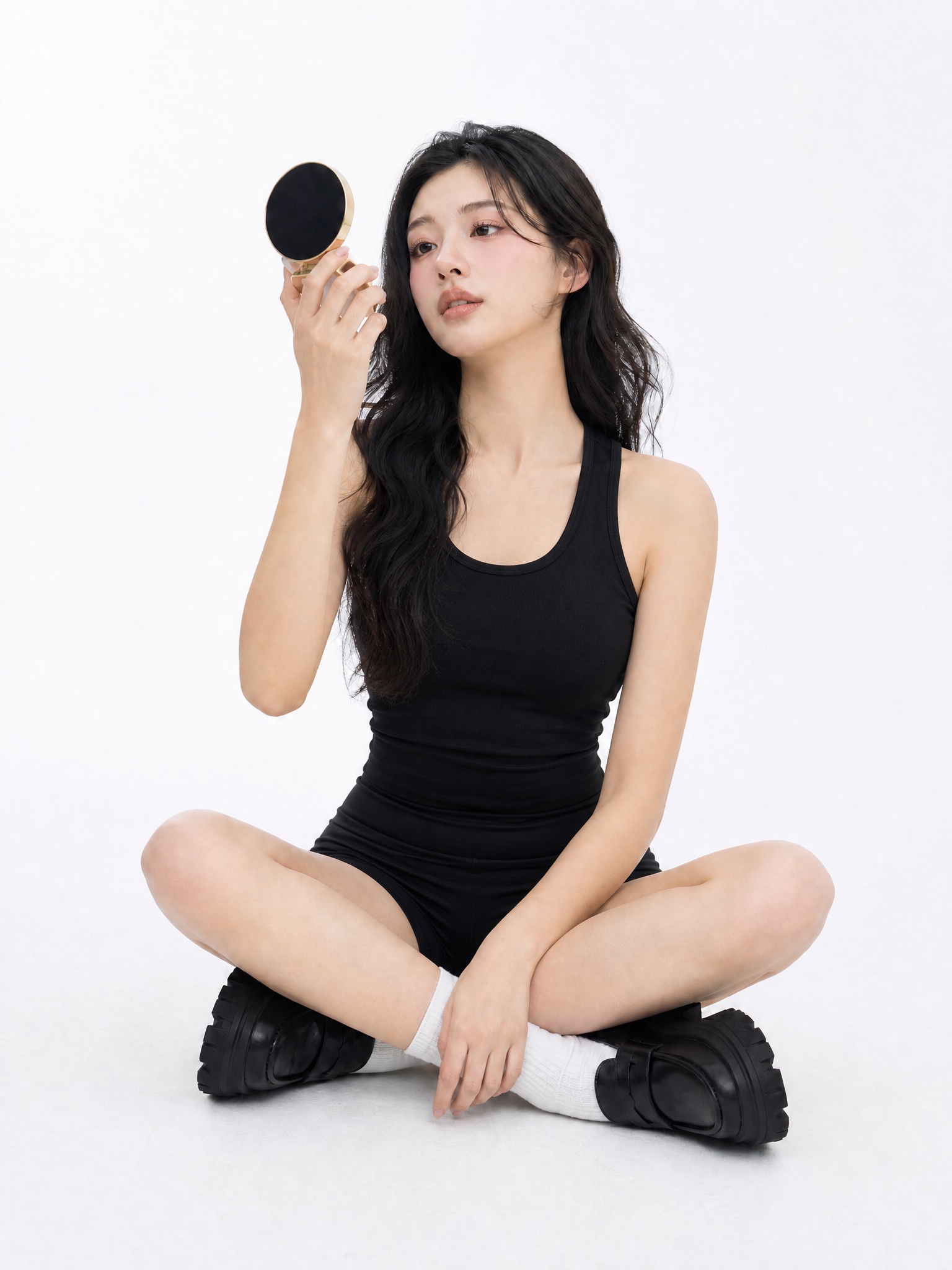 Clothes swapper AI after — same pose in black tank and shorts, white studio